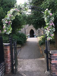 Pink and white church archway floral arrangement